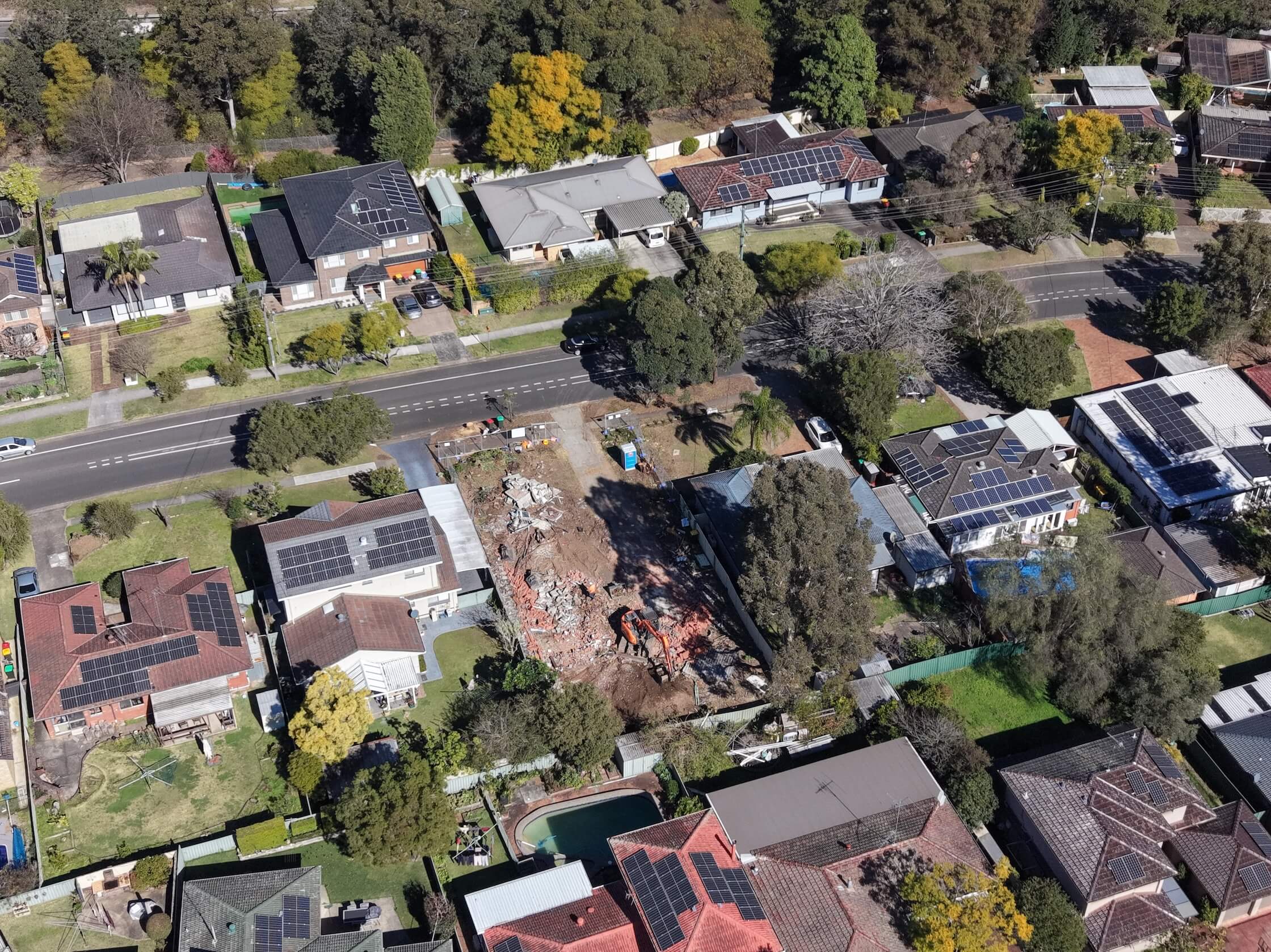 Drone field image showing excavation equipment at a development site